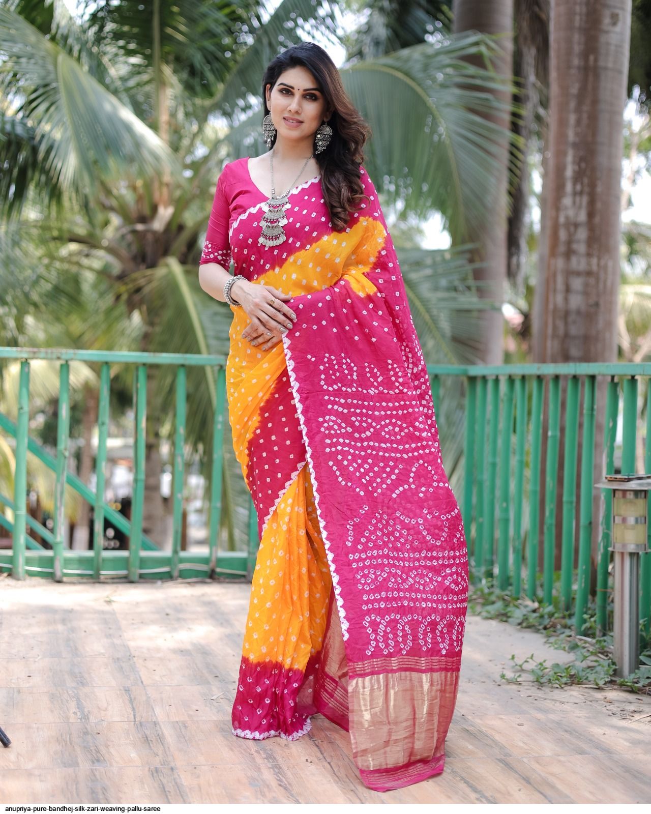 Deep pink and black color single border plain pata saree.