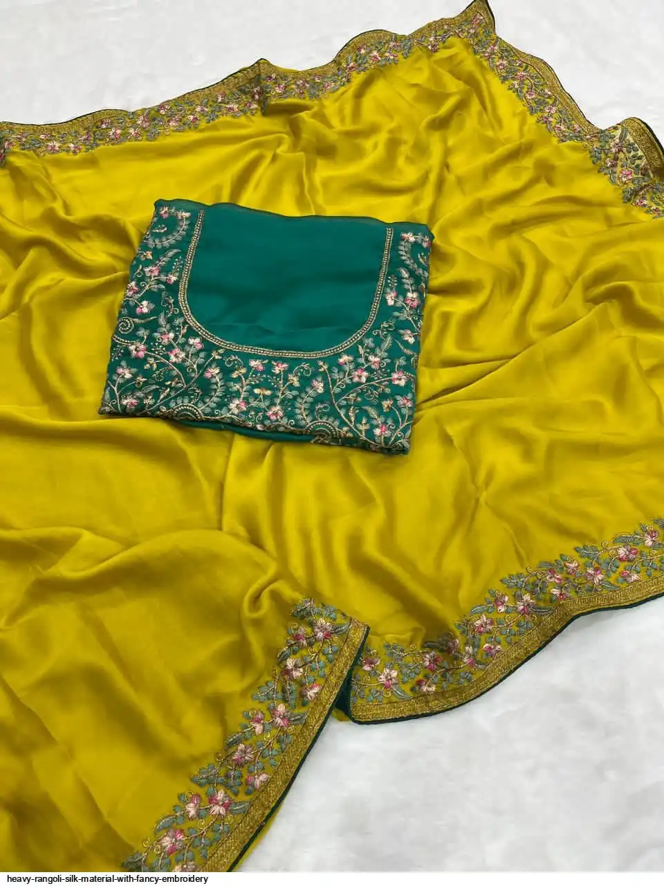 Rangoli Heavy Rangoli silk material with fancy Embroidery Wholesale Catalog