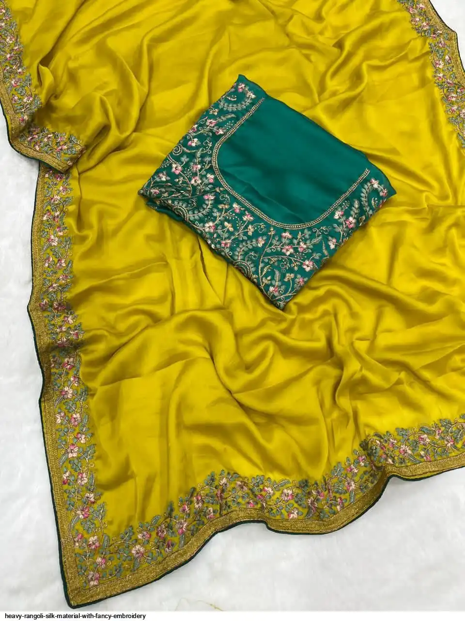 Rangoli Heavy Rangoli silk material with fancy Embroidery Wholesale Catalog