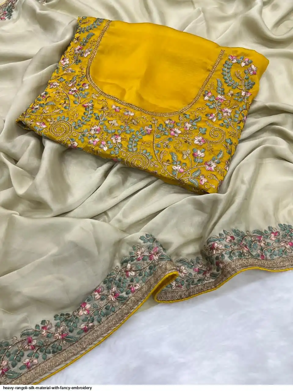 Rangoli Heavy Rangoli silk material with fancy Embroidery Wholesale Catalog