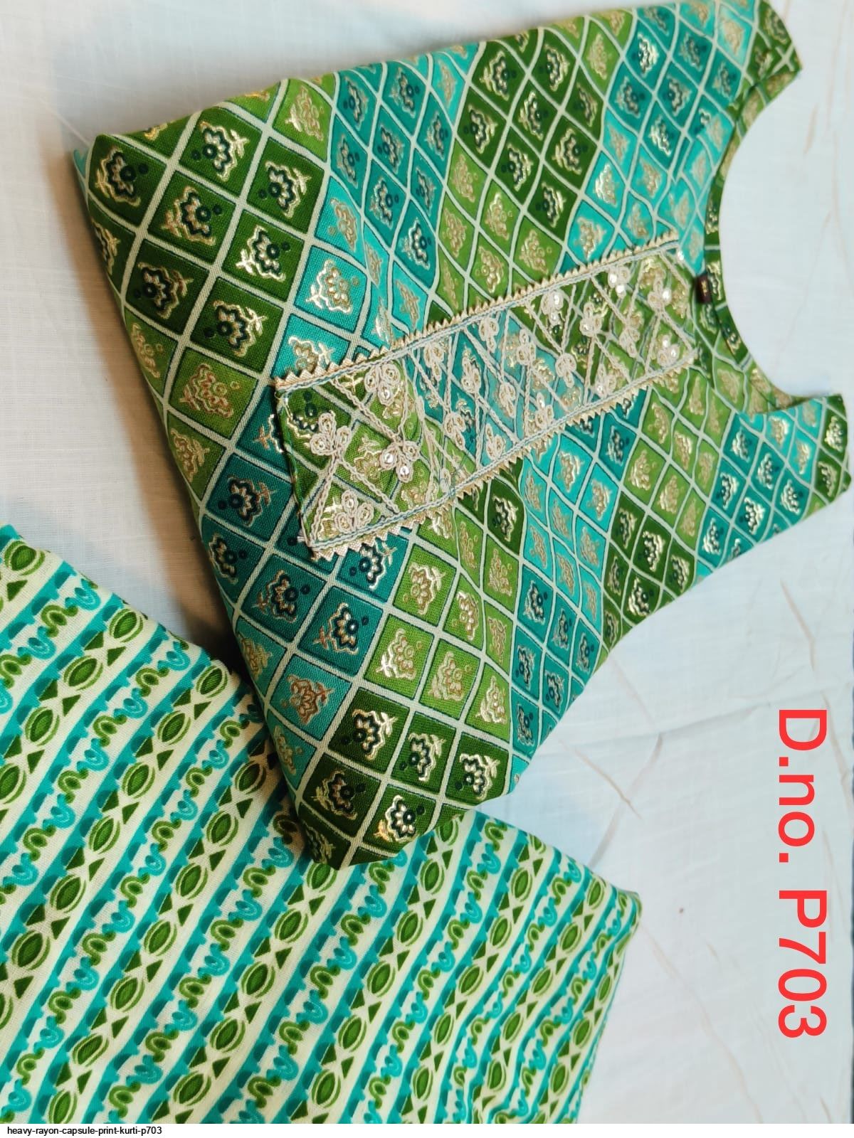 HEAVY RAYON CAPSULE PRINT KURTI P703