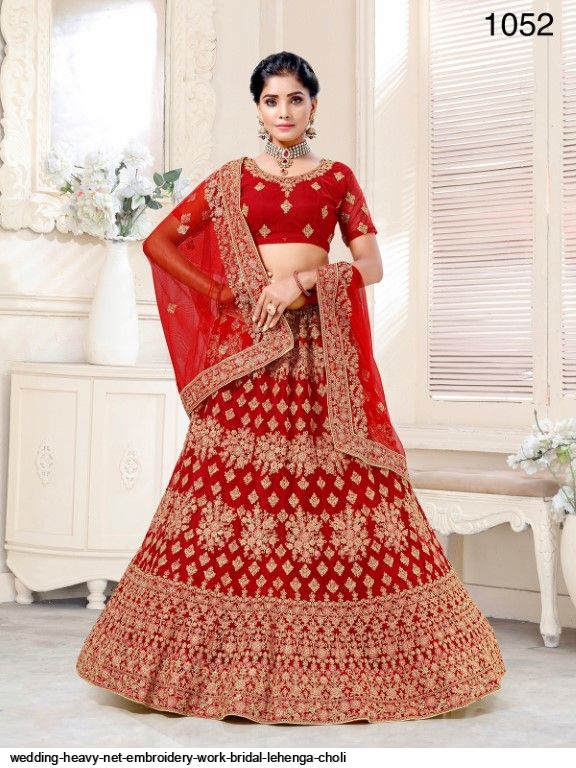 Wonderful Wine Color Net With Heavy Work Bridal Lehenga Choli